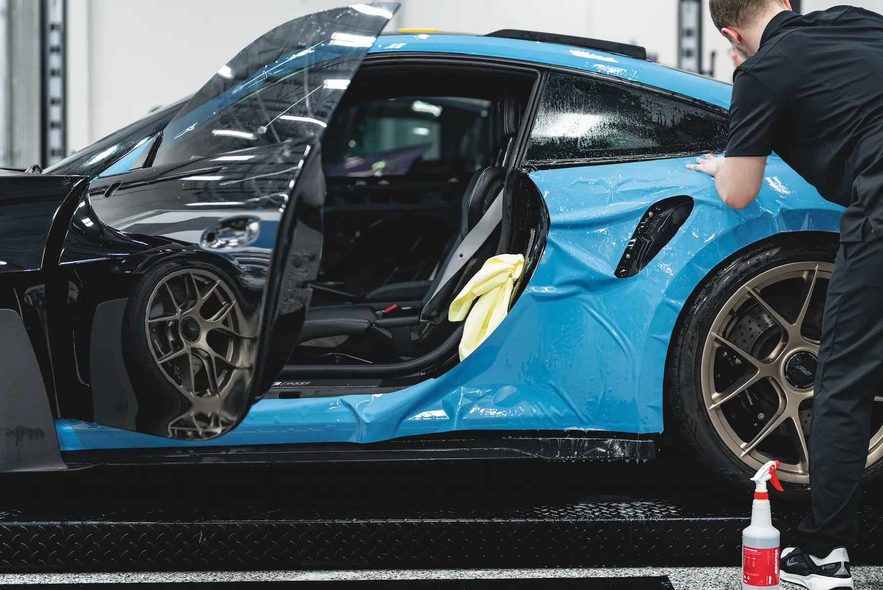 Professional XPEL COLOR PPF installation process at Bespoke Auto Design Miami